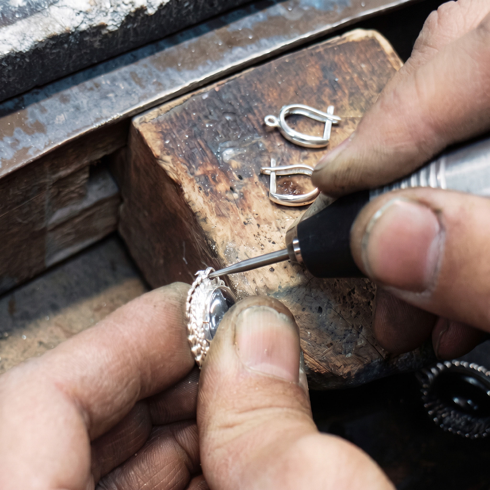 Jeweller working on a piece at the bench